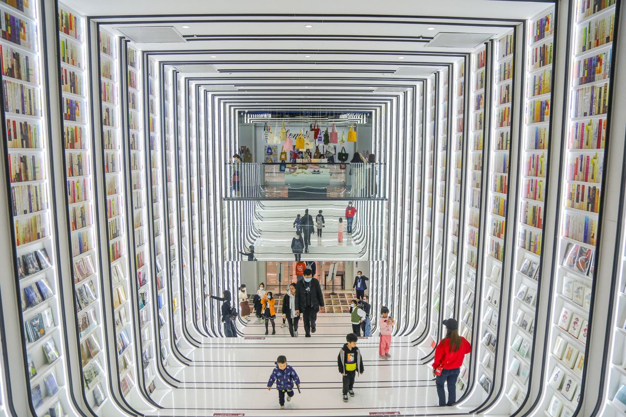 This photo taken on Wednesday shows people visiting a book store in Foshan in China's southern Guangdong province. 