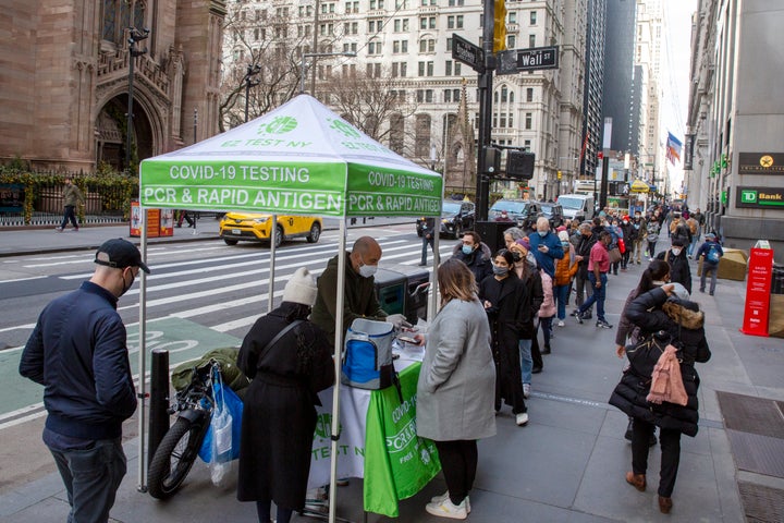 New yorkers line up for covid-19 tests on wall street on thursday.