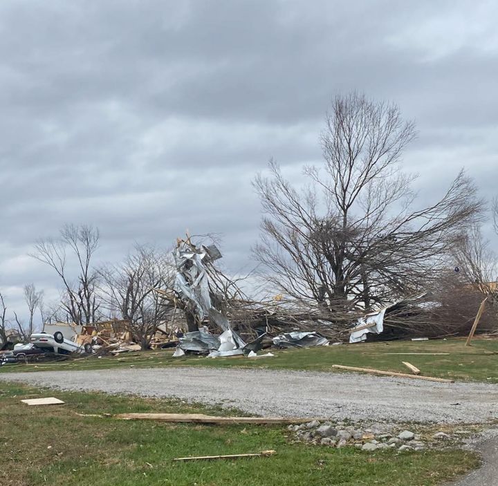 An upside down car and other destruction created by the storms in Christian County, Kentucky.