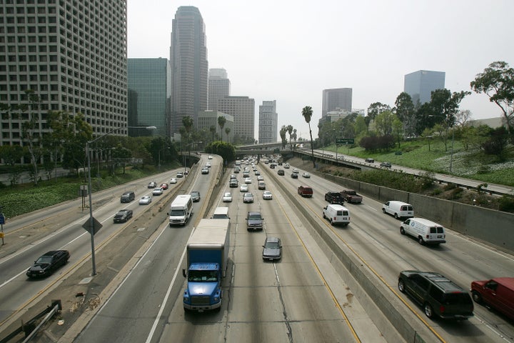 A haze hangs over downtown Los Angeles, where traffic and vast freeways infamously spur smog.