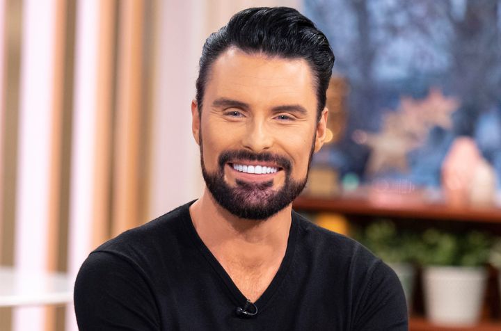 Rylan pictured with his old veneers in 2019