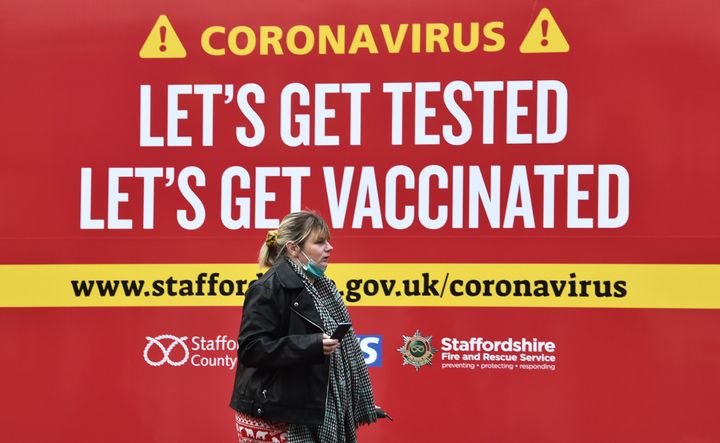  A woman walks past a coronavirus test centre in Newcastle-Under-Lyme.