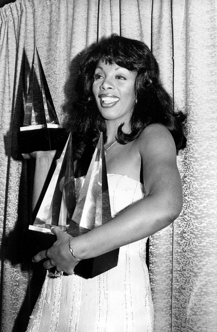 Donna Summer holds the three statuettes she won at the American Music Awards on Jan. 12, 1979, in Los Angeles. A few months later, she was featured in Rona Barrett's Hollywood magazine, which included a portrait that now has fans seeing her "twin" in Kelly Rowland.