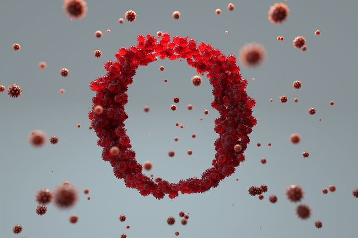 Digital generated image of COVID-19 cells organised into circular shape and made OMICRON sign on grey background.