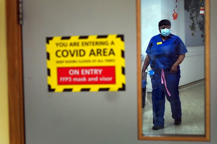 A nurse walks through a Covid ward at King's College Hospital, in south east London.