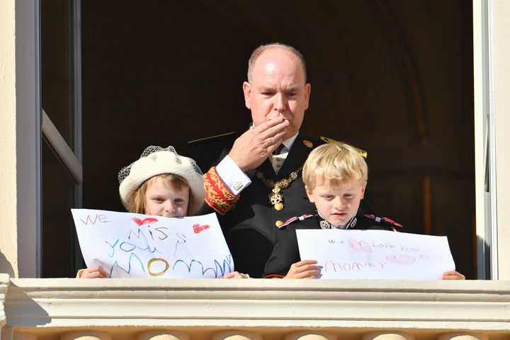 At the Monaco National Day celebrations last month, Charlene and Albert’s twins held signs that said “we miss you Mommy” and “we love you Mommy.”