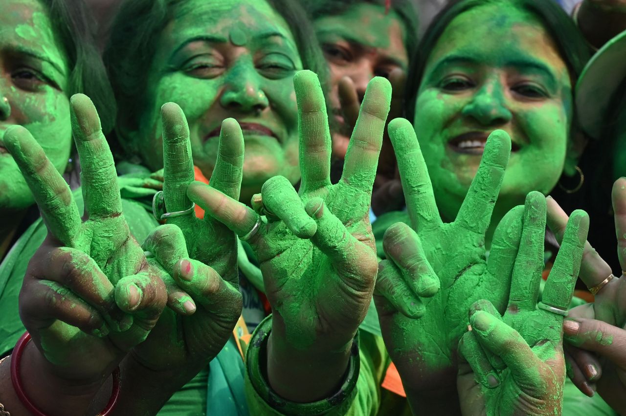 Supporters of the Trinamool Congress (TMC) celebrate the party's victory in the Kolkata Municipal Corporation (KMC) elections, near the residence of the India's West Bengal Chief Minister and TMC leader Mamata Banerjee, in Kolkata on Tuesday. 