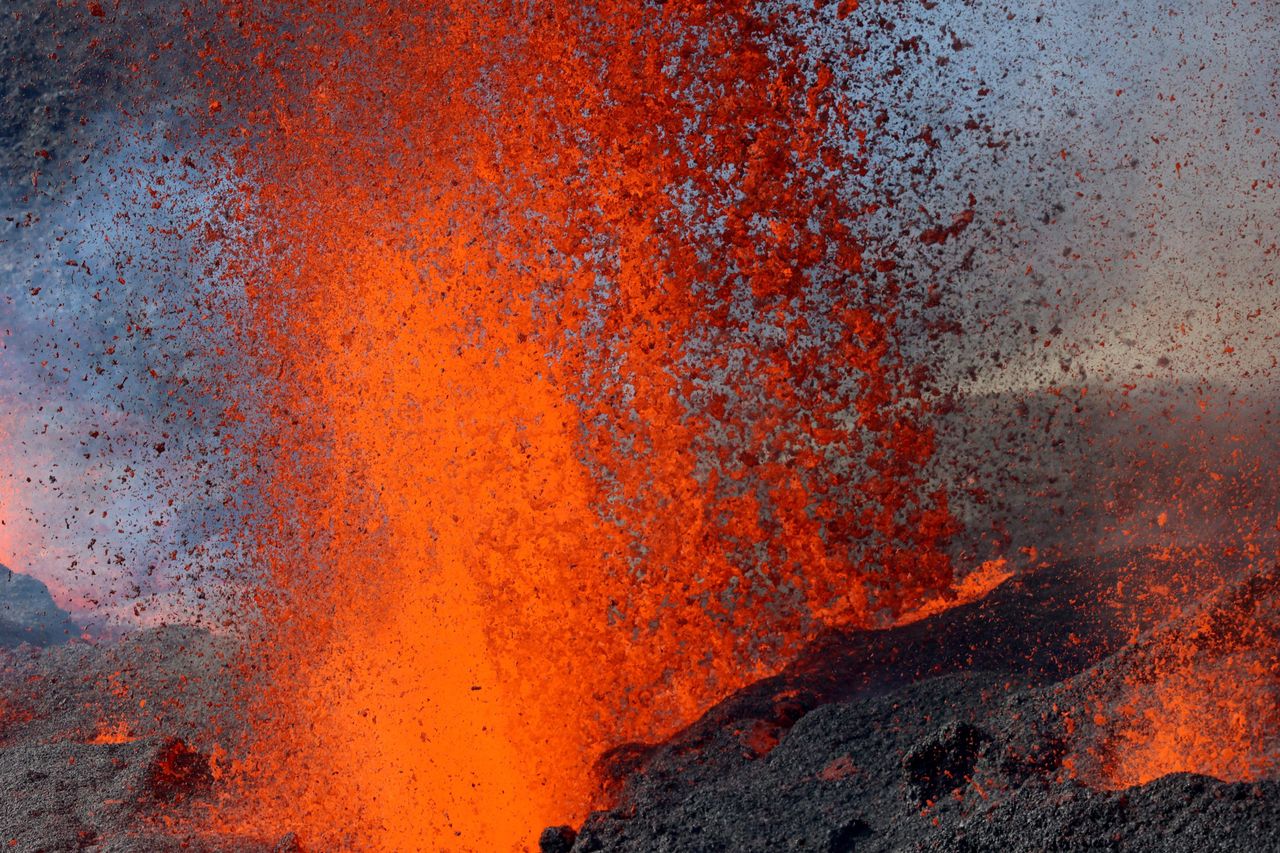 This aerial photograph taken on Wednesday shows the erupting Piton de la Fournaise volcano on the French Indian Ocean island of Reunion. The Piton de la Fournaise, the volcano of Reunion, erupted for the second time of the year on Dec. 22 at 3:30 a.m. At least three eruptive cracks have opened on the southern flank of the volcano in the enclosure (the central caldera of the volcano), volcanologists have noted.