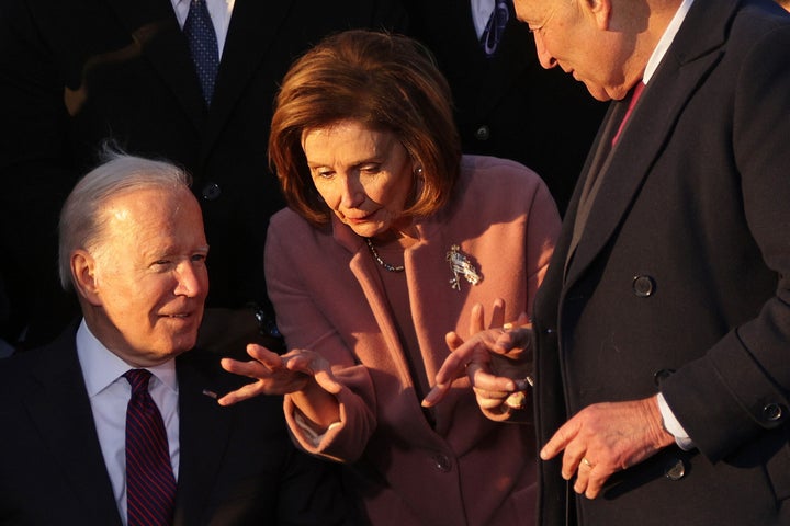 Biden, House Speaker Nancy Pelosi (D-Calif.) and Senate Majority Leader Chuck Schumer (D-N.Y.) at November's signing ceremony for the Infrastructure Investment and Jobs Act. Manchin's opposition to the House version of Build Back Better may force them to make the kind of choices among Democratic initiatives they had hoped to avoid.