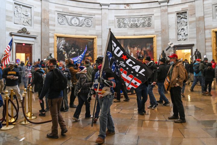 Supporters of Donald Trump roam under the Capitol Rotunda after invading the Capitol building on Jan. 6, 2021, in Washington, D.C.