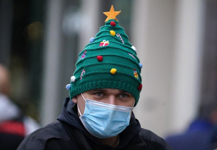 A Christmas shopper wears a festive hat on Buchanan Street in Glasgow.