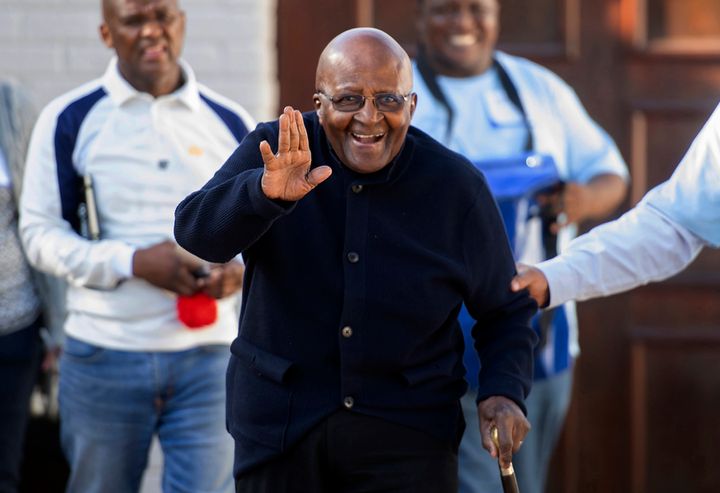 Desmond Tutu waves as he exits his home in Cape Town, South Africa Monday May 6, 2019. (AP Photo, File).