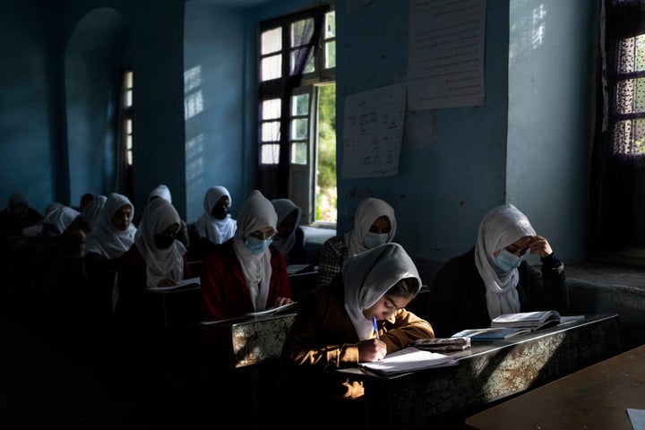 Afghan girls participate a lesson at Tajrobawai Girls High School, in Herat, Afghanistan, Thursday, Nov. 25, 2021. (AP Photo/Petros Giannakouris)