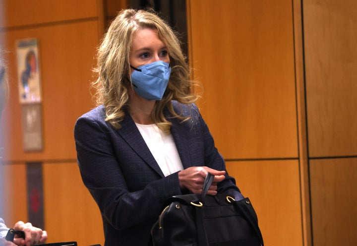 Theranos founder and former CEO Elizabeth Holmes goes through a security checkpoint as she arrives at the Robert F. Peckham Federal Building on December 17, 2021 in San Jose, California. 