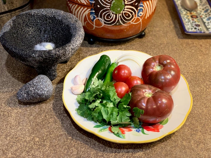 The makings of a typical salsa roja that my father prepares. Once finished, we eat the salsa right out of the molcajete.