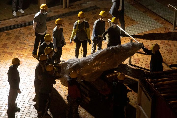 The "Pillar of Shame" statue, a memorial for those killed in the 1989 Tiananmen crackdown, is removed from the University of Hong Kong, on Dec. 23, 2021. 