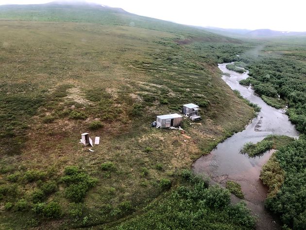 This photo provided by the U.S. Coast Guard District 17 shows a remote mining camp near Nome, Alaska,...