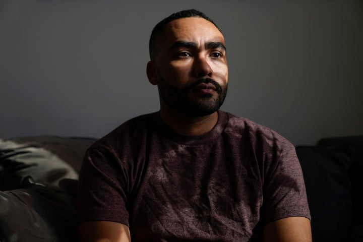 Kyle Bibby poses for a picture at his home in Jersey City, N.J., Wednesday, Nov. 24, 2021. Bibby, a Naval Academy graduate who served for six years in the Marine Corps as an infantry officer, said those who characterize white supremacism only as extreme behavior miss the insidious damage that casual racism and discriminatory attitudes can inflict. "We view white supremacy as like, you know, somebody's got the cross in the truck and they're rolling to your crib to go burn it," said Bibby, who co-founded the Black Veterans Project, which advocates for racial justice in the armed services. But the cuts are much more subtle, he said. (AP Photo/Seth Wenig, File)