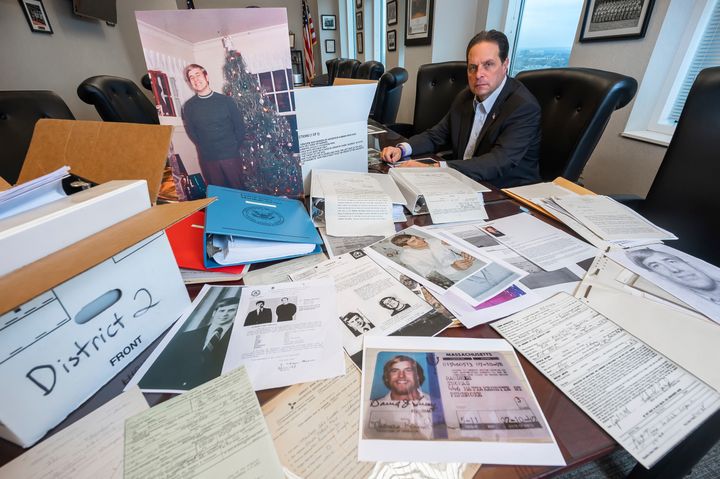 U.S. Marshal Peter J. Elliott poses for a photograph on December 16, 2021, at the U.S. Courthouse in the Carl B. Stokes case in Cleveland with items related to the 1969 bank robbery.