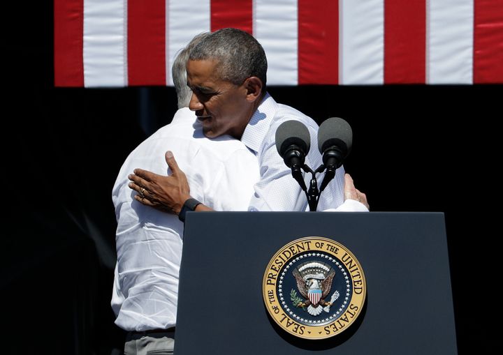 Reid, left, embraces then-President Barack Obama in August 2016. He was a loyal enforcer of Obama's agenda, but broke with the president during negotiations over Social Security.