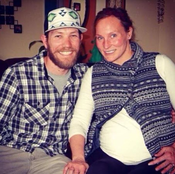 The author, eight months pregnant, and her husband, Andrew, celebrating Christmas with family in Denver, Colorado, in 2013.