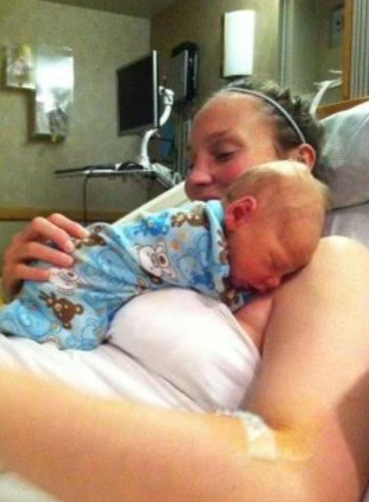 The author holding her newborn, Van, in the hospital in Denver, Colorado, after being readmitted with complications just weeks after he was born (2014).