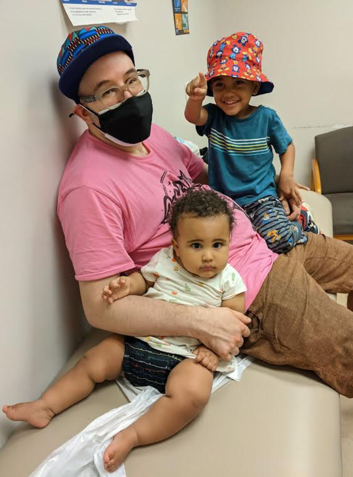 The author and his two kids at the doctor's office.