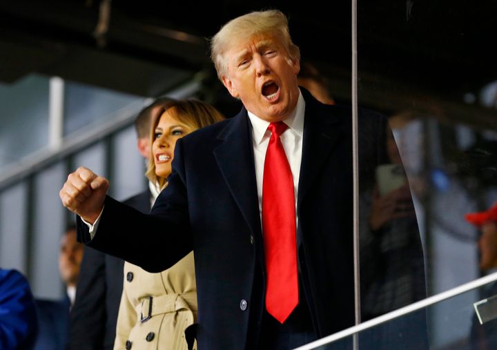 Former president of the United States Donald Trump waves prior to Game Four of the World Series between the Houston Astros and the Atlanta Braves Truist Park on October 30, 2021 in Atlanta, Georgia.