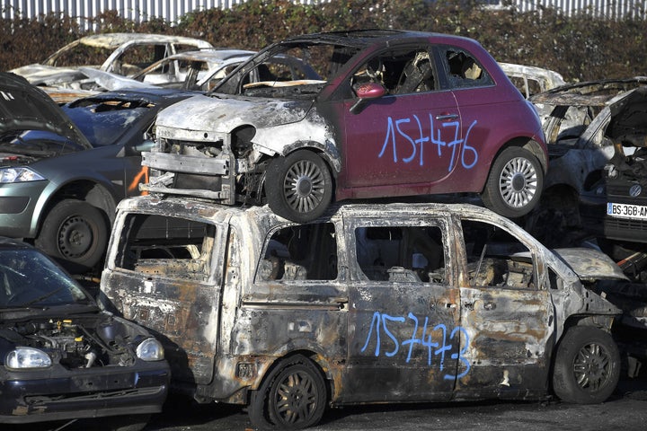 A picture taken on January 1, 2022 in a car breakers yard shows burnt-out cars collected by city employees after the New Year's Eve in the eastern French city of Strasbourg.