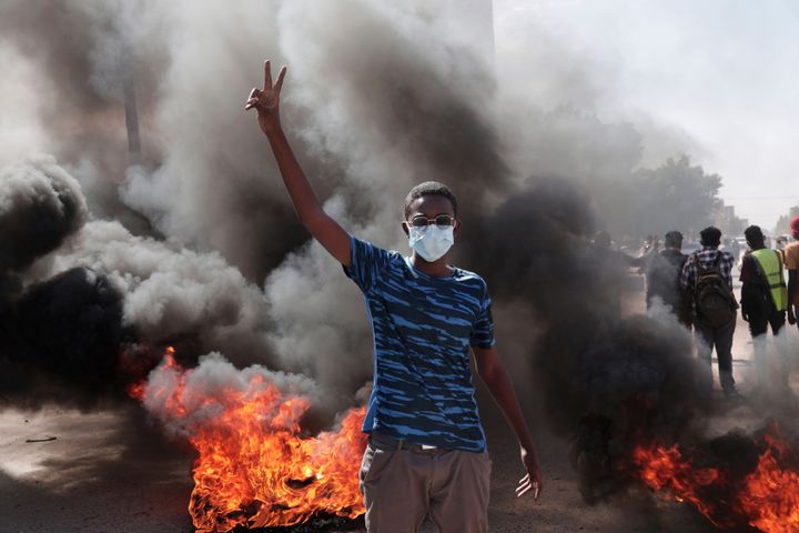 Sudanese security forces fired tear gas to disperse protesters as thousands rallied in Khartoum. 