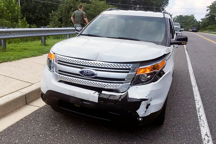 This July 29, 2016 photo provided by Celeste Norris shows Ashli Babbitt's damaged vehicle after a road rage incident where Babbitt, who then had the last name McEntee, rammed the back of Norris' SUV three times as part of a fight over an extramarital affair.