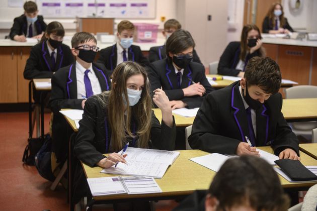 Year 10 students wearing face masks at Park Lane Academy in Halifax, northwest England on January 4, 2022. 