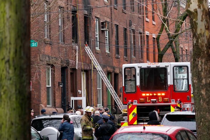 Philadelphia firefighters work at the scene of a deadly row house fire, on Jan. 5, 2022, in the Fairmount neighborhood of Philadelphia.