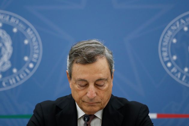 Italy's Prime Minister Mario Draghi attends a joint news conference with Italy's Economy Minister Daniele...