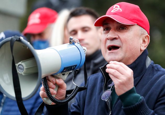 Srdan Dojkovic, megaphone in hand at a demonstration in support of the