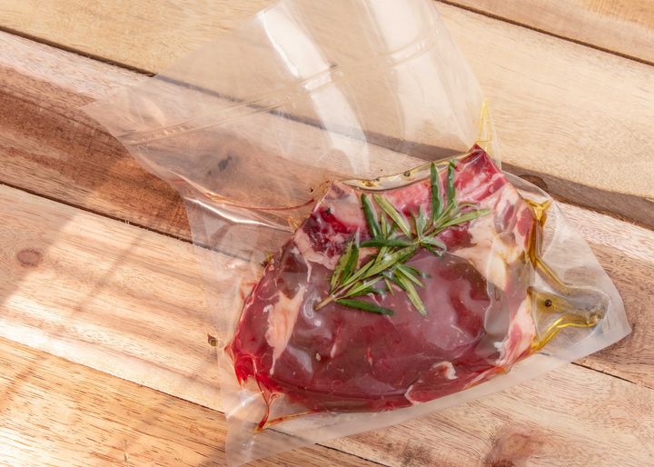 A piece of vacuum-sealed beef awaits the immersion circulator.