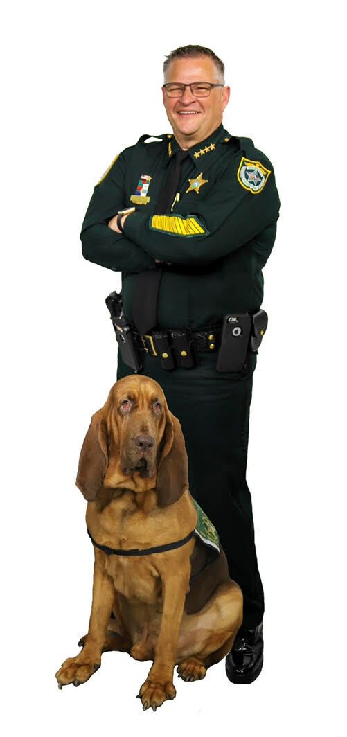 Brevard County Sheriff Wayne Ivey and his dog.