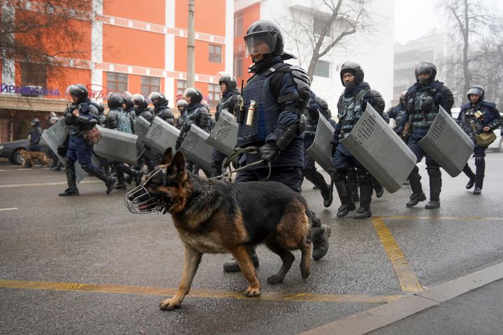 Riot police walk to block demonstrators gathering during a protest in Almaty, Kazakhstan, on Jan. 5, 2022. Demonstrators denouncing the doubling of prices for liquefied gas have clashed with police in Kazakhstan's largest city and held protests in about a dozen other cities in the country.