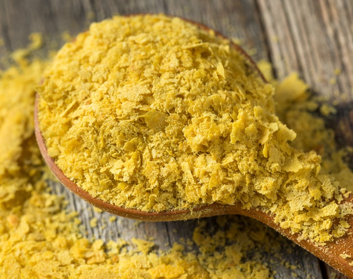 Nutritional yeast is a flaky vegan ingredient that imparts a cheesy flavor to whatever dish you add it to.