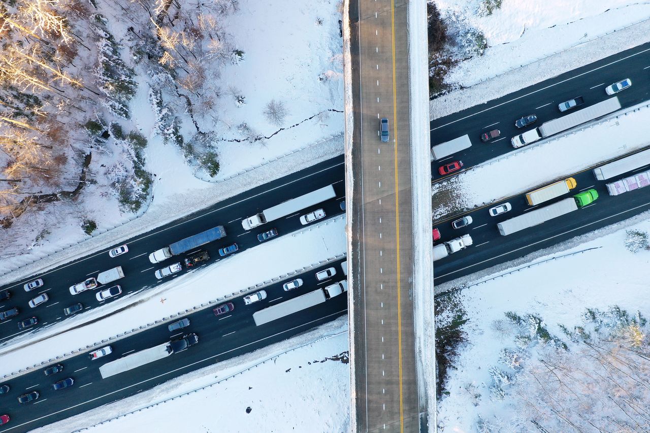 In an aerial view, traffic creeps along Virginia Highway 1 after being diverted away from Interstate 95, which was closed due to a winter storm on Tuesday near Fredericksburg in Stafford County, Virginia.