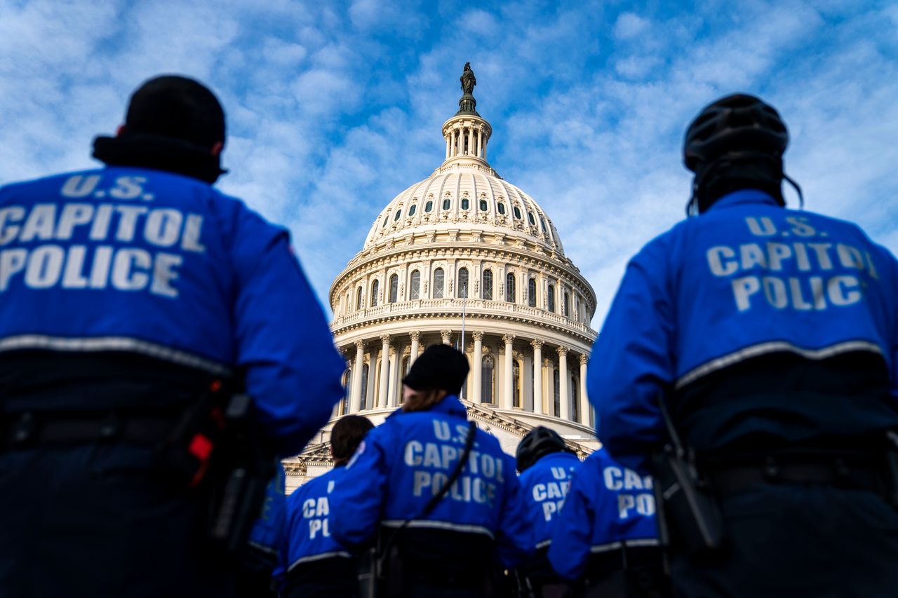 U.S. Capitol Police officers stand on the East Front Plaza after a Thursday morning roll call on Capitol Hill in Washington, D.C.