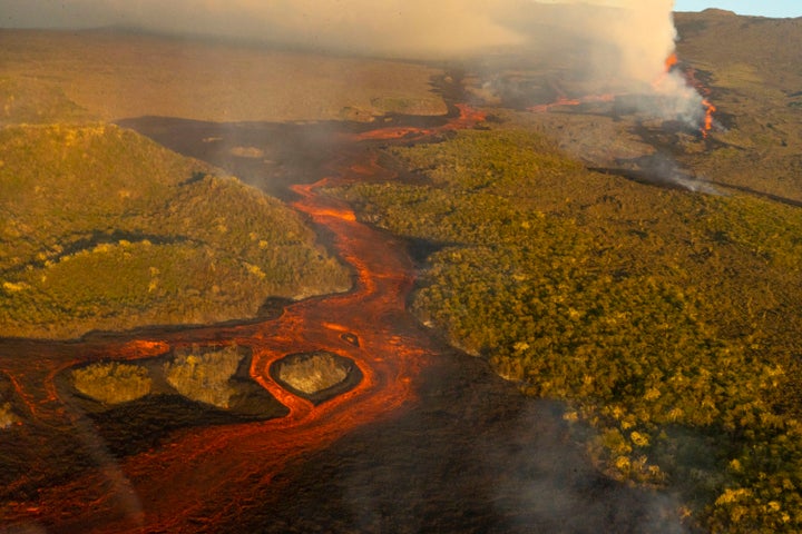 This photo released by the the National Galapagos Park communications office shows, from above, lava from the eruption of Wolf Volcano on Isabela Island, Galapagos Islands, Ecuador, Friday, Jan. 7, 2022. (Wilson Cabrera/National Galapagos Park communications office via AP)