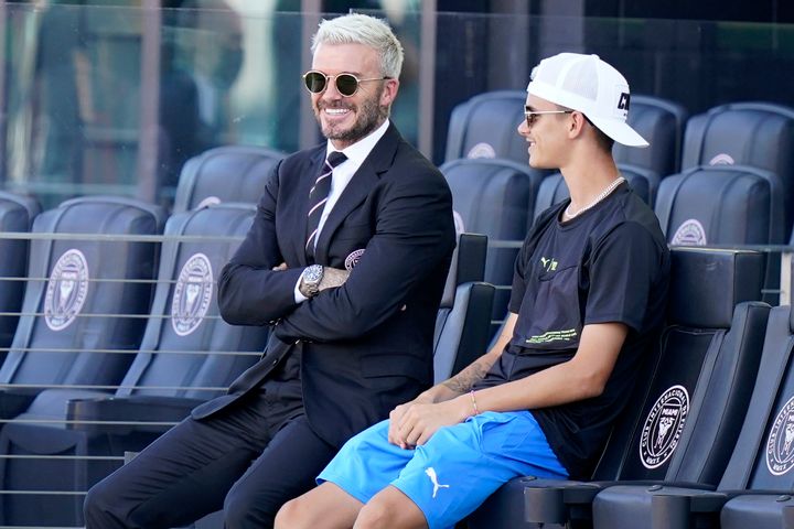 David and Romeo Beckham pictured in the stands in Fort Lauderdale in August 2021