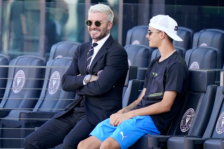 David and Romeo Beckham pictured in the stands in Fort Lauderdale in August 2021