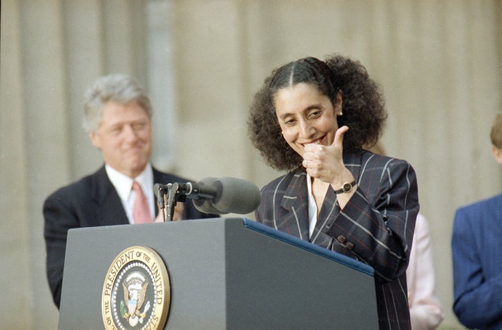 Lani Guinier, President Bill Clinton's nominee for assistant attorney general for the Civil Rights Division, gives a thumb's up after the president introduced her during a ceremony at the Justice Department in Washington, April 29, 1993.