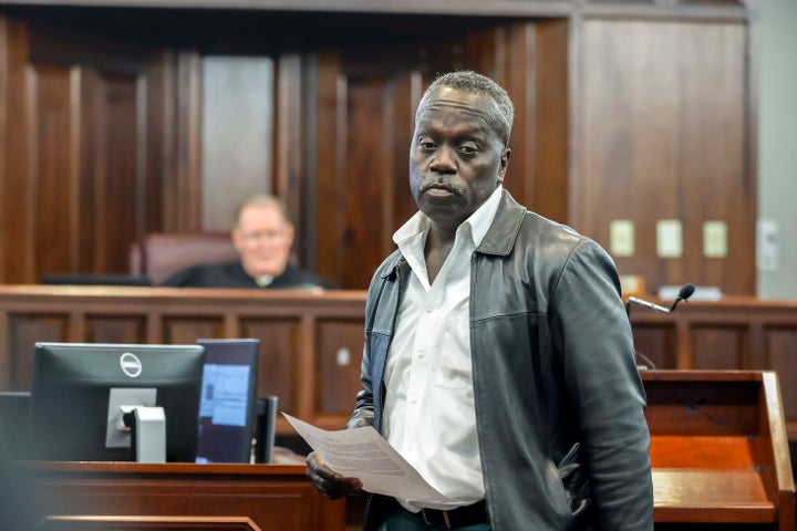 Ahmaud Arbery's father Marcus Arbery's leaves the podium after giving his impact statement to Superior Court Judge Timothy Walmsley during the sentencing of Greg McMichael and his son, Travis McMichael, and a neighbor, William "Roddie" Bryan in the Glynn County Courthouse, on January 7, 2022 in Brunswick, Georgia.