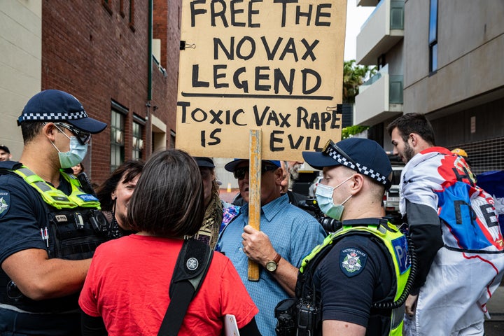 Serbian tennis fans and anti vaccination protesters argue with pro-refugee supporters outside the Park Hotel on January 08, 2022 in Melbourne, Australia.
