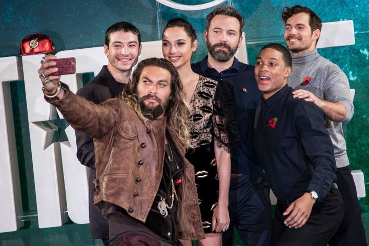 From left, actors Jason Momoa, Ezra Miller, Gal Gadot, Ben Affleck, Ray Fisher and Henry Cavill appear at a photo call for "Justice League" in London on Nov. 3, 2017.