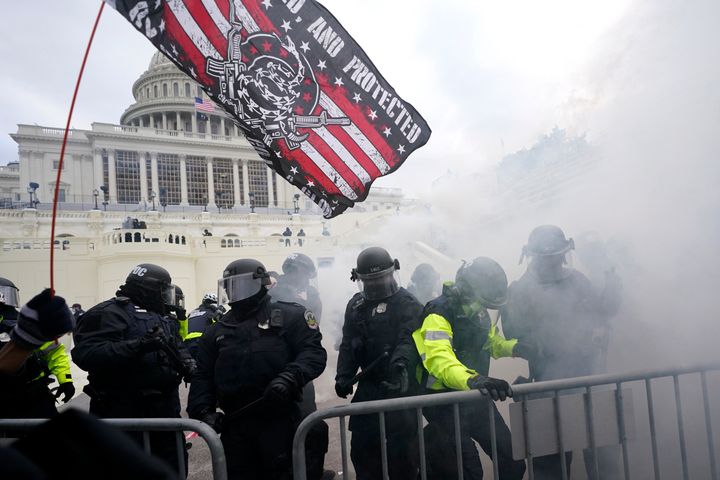Police hold off violent insurrections loyal to then-President Donald Trump as they try to break through a police barrier Jan. 6, 2021, at the Capitol in Washington. (AP Photo/Julio Cortez, File)