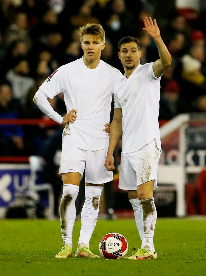 Soccer Football - FA Cup Third Round - Nottingham Forest v Arsenal - The City Ground, Nottingham, Britain - January 9, 2022 Arsenal's Cedric Soares and Martin Odegaard prepare for a free kick REUTERS/Craig Brough